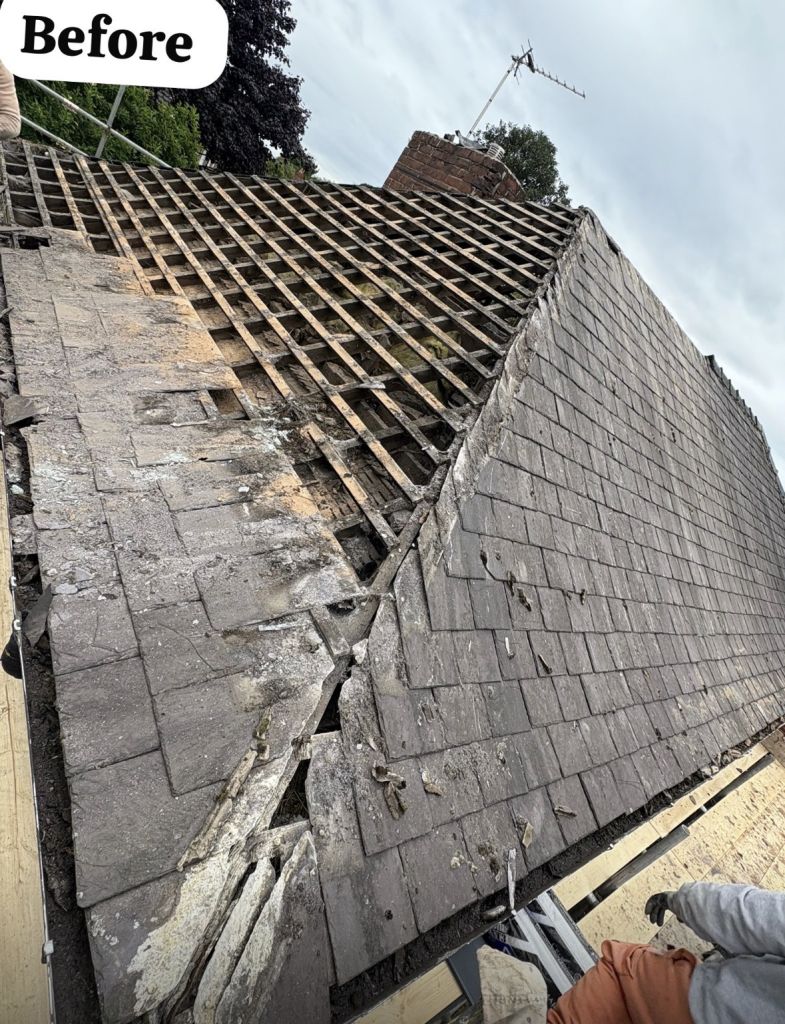 Natural slate re-roof on brick detached house — Before