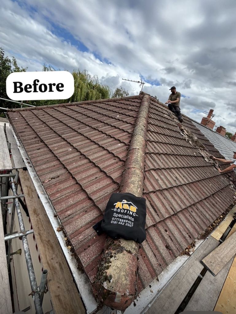 Red tile pitched roof re-roofing with ridge detail — Before