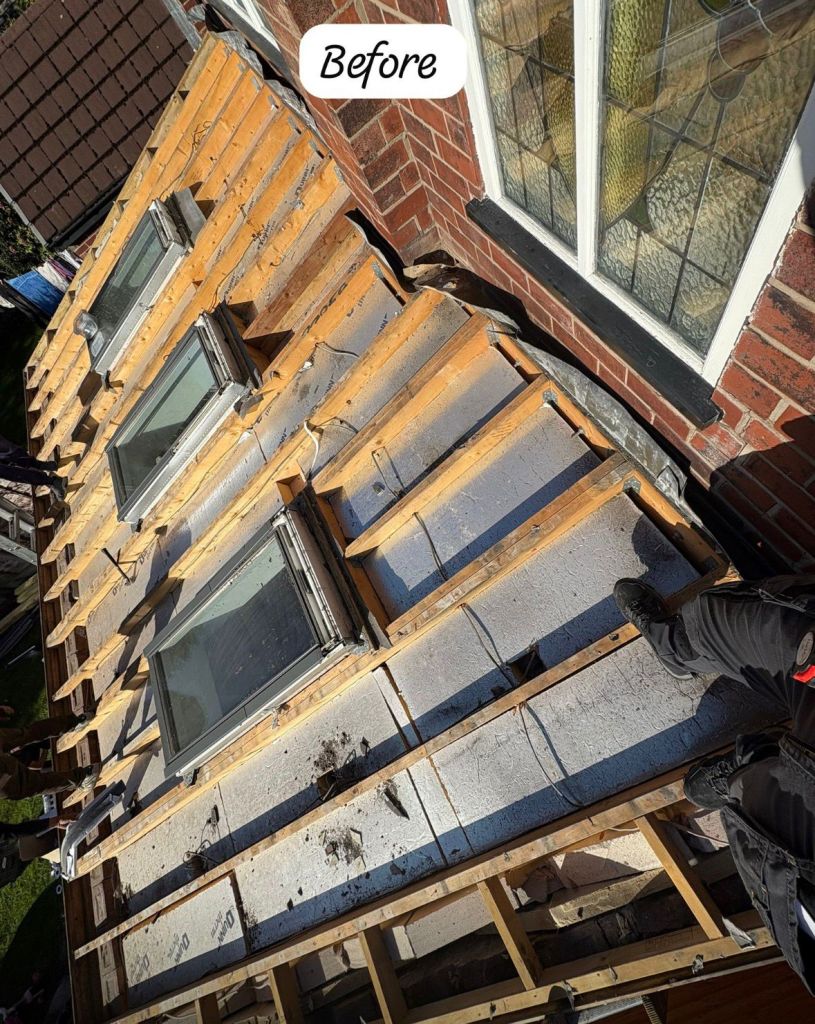 Grey tile roof retiling with multiple Velux upgrades — Before