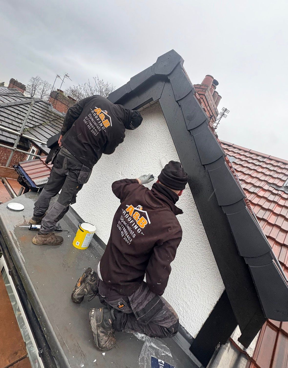 AB Roofing team completing detailed roof work in Manchester