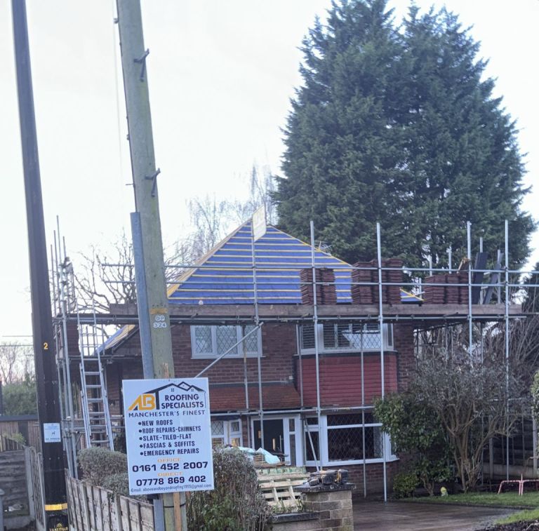 Side view of hipped roof underlay and battens during roof installation
