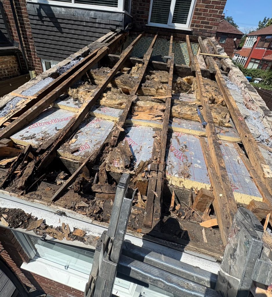 Flat to pitched roof conversion over patio — Before