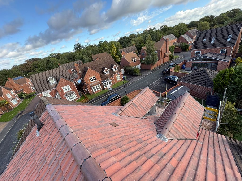 Red tile re-roof with twin dormers — After
