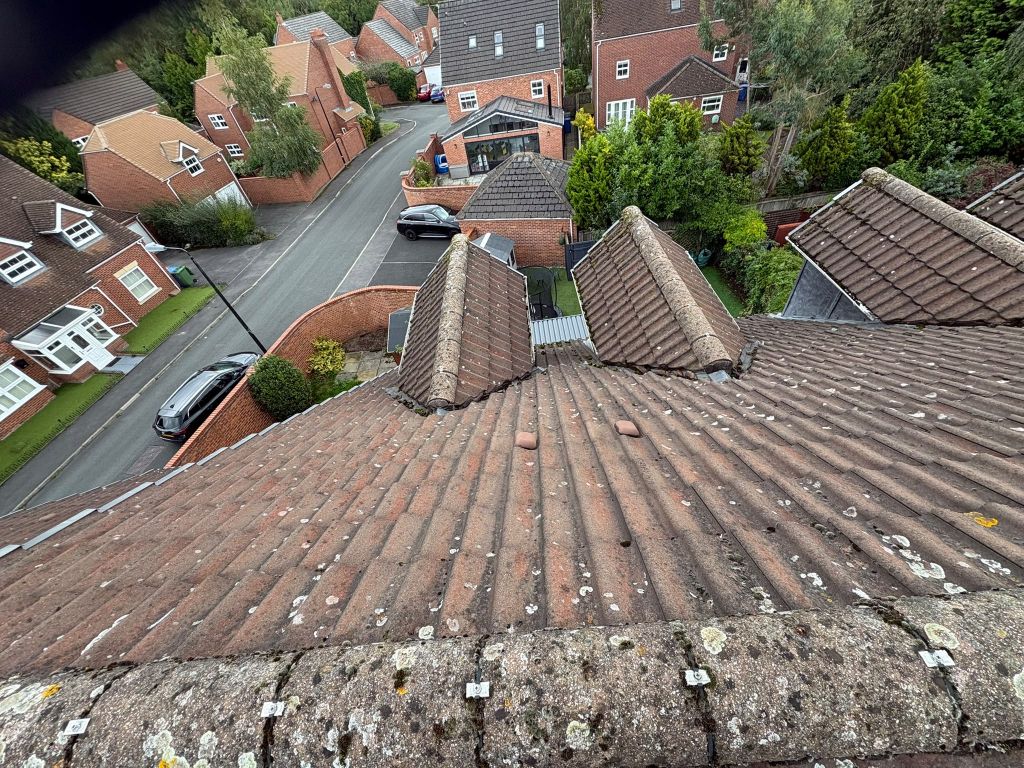 Red tile re-roof with twin dormers — Before
