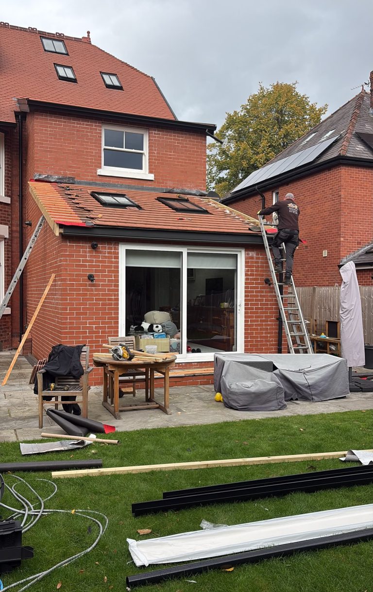 Wide view of ongoing roof work on a rear extension